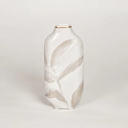 Modern white ceramic decorative vase with beige leaf artwork and gold rim ideal for console table shelf and stylish home decor.