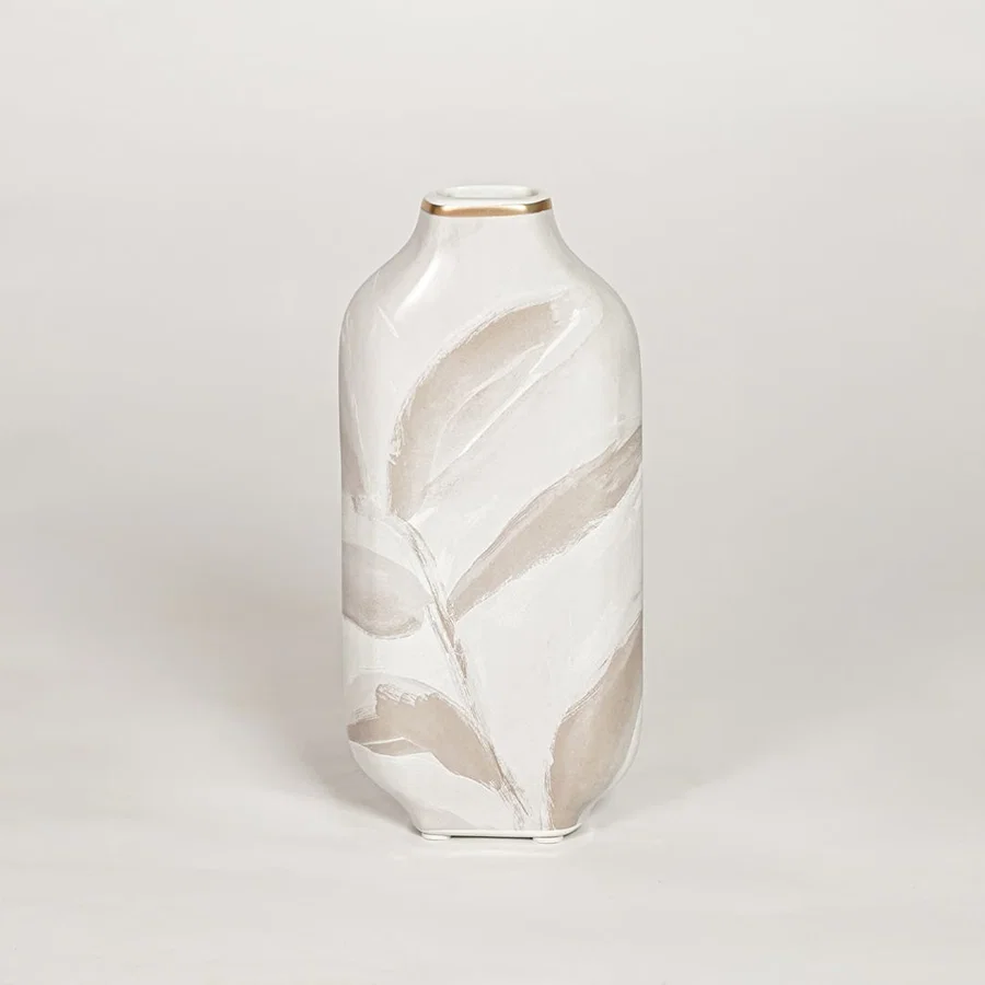 Modern white ceramic decorative vase with beige leaf artwork and gold rim ideal for console table shelf and stylish home decor.